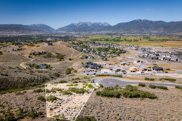 Mountain view featuring nearby suburban area and a desert landscape