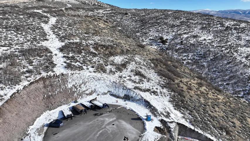 Snowy aerial view featuring a mountain view