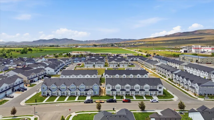 Aerial perspective showcasing a community of townhomes and single-family residences