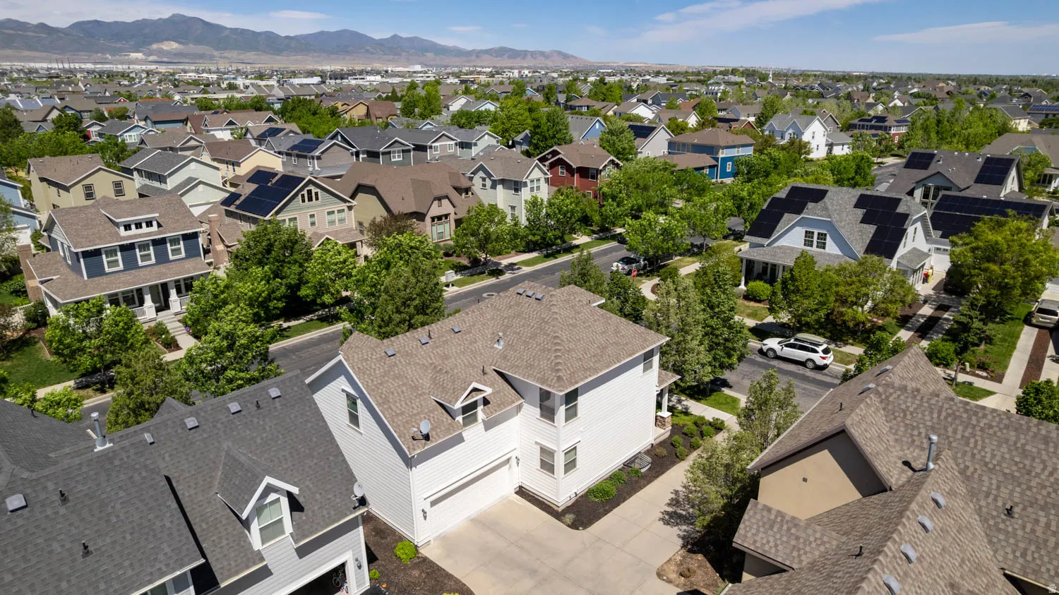 Aerial perspective of a neighborhood featuring residential properties with varying architectural styles