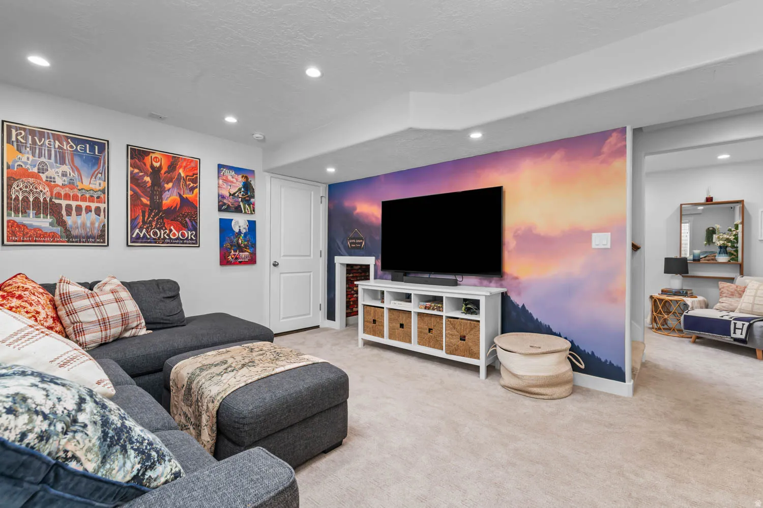 Carpeted living space featuring recessed lighting and a decorative accent wall