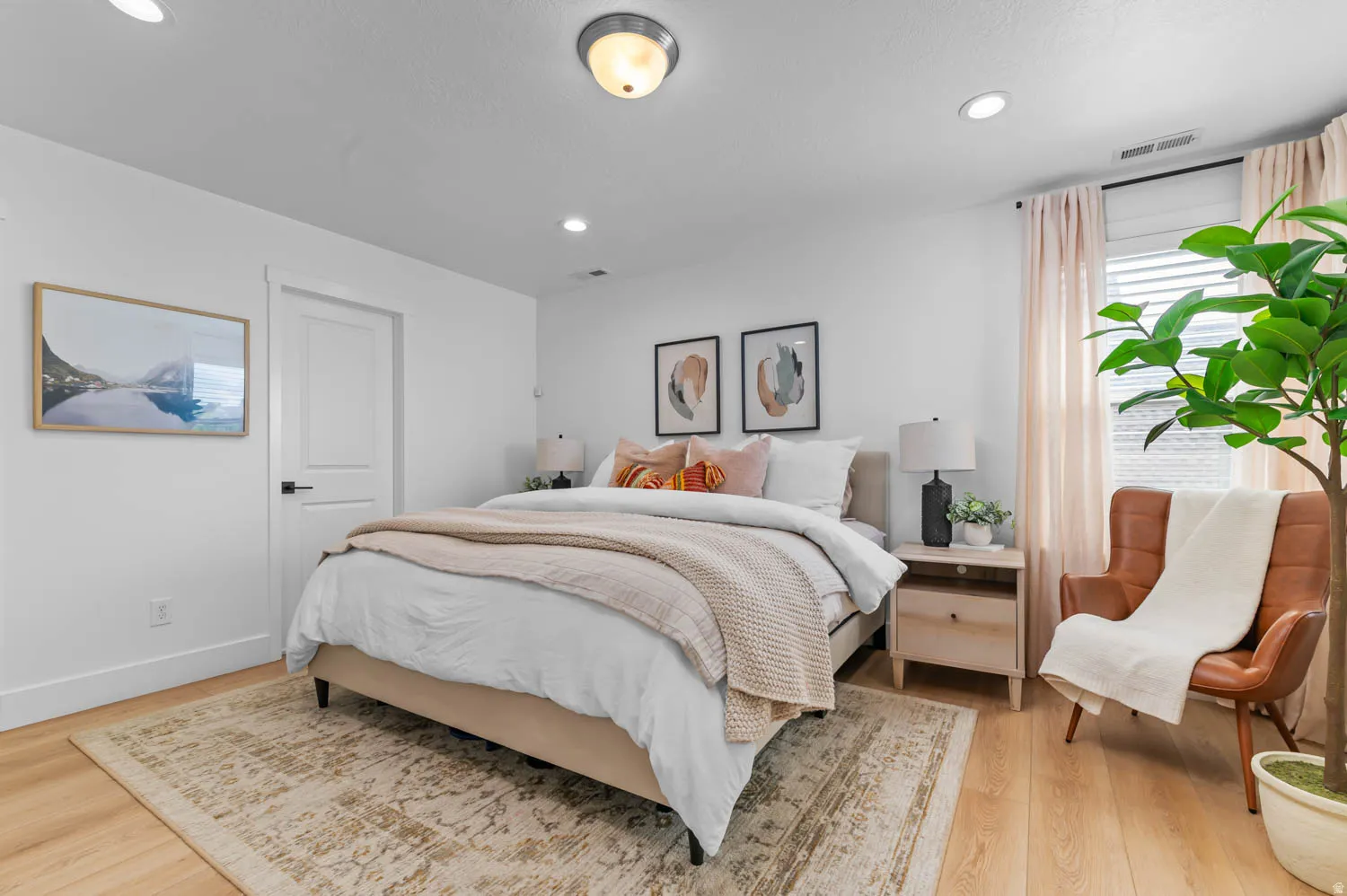Light wood-finish flooring complements white walls and trim
