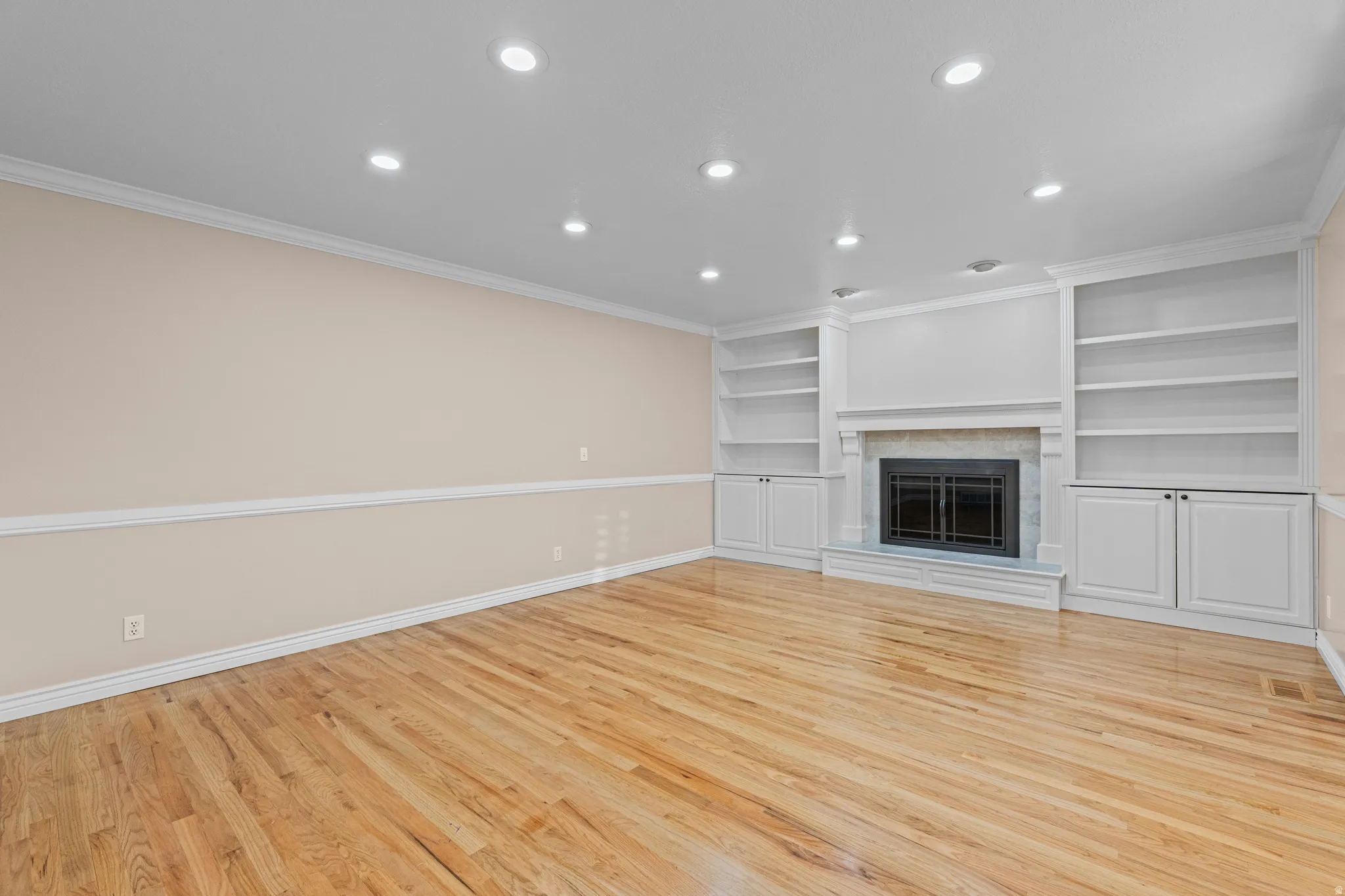 Hardwood flooring and recessed lighting throughout