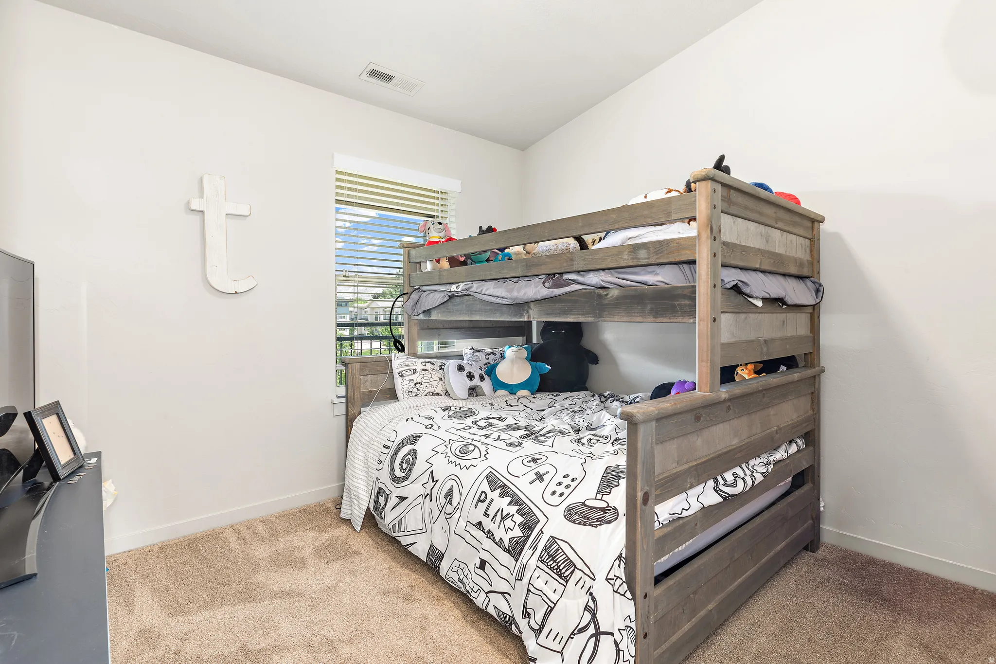 Bedroom featuring light-colored walls and carpeted flooring