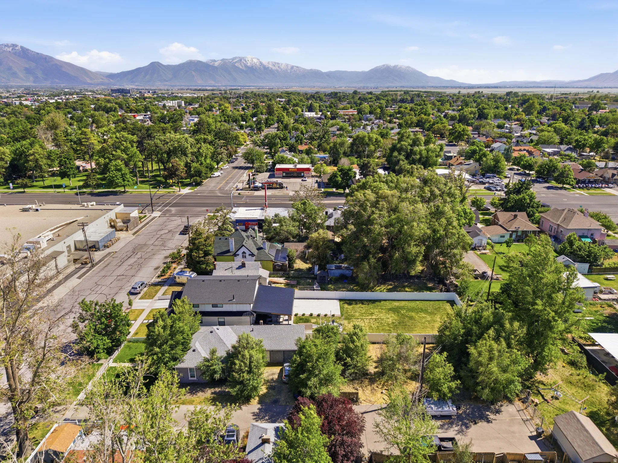 Aerial perspective showcasing a residential area with varied architecture and mature trees