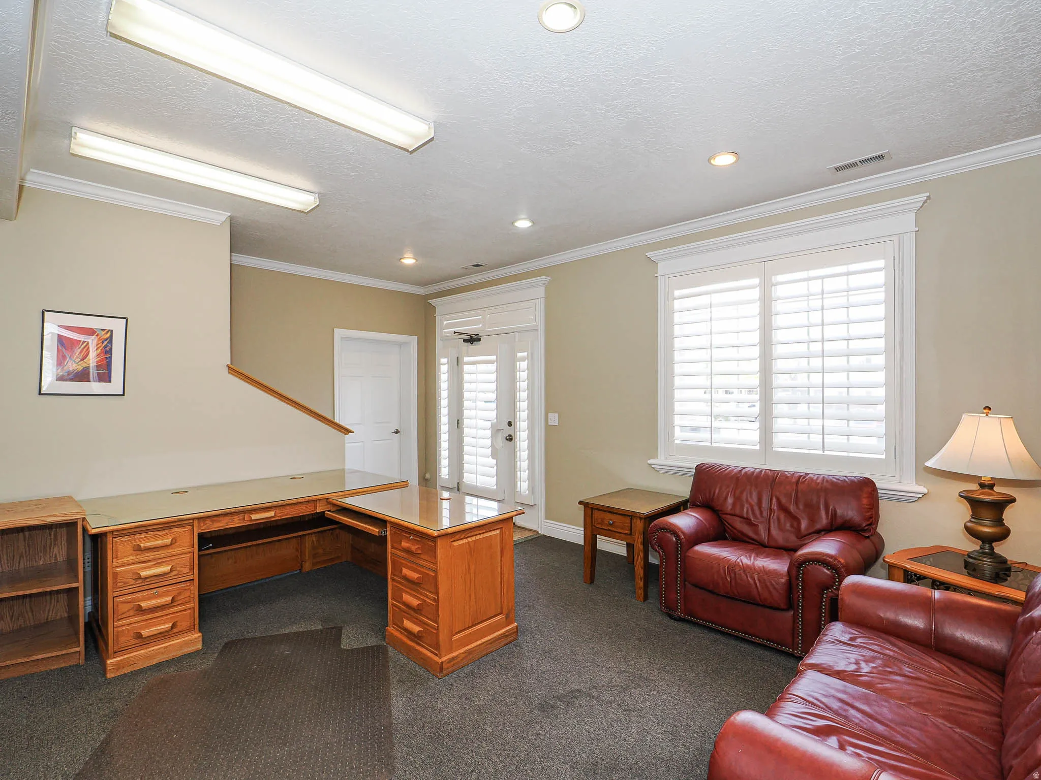 Home office featuring crown molding, a textured ceiling, and recessed lighting