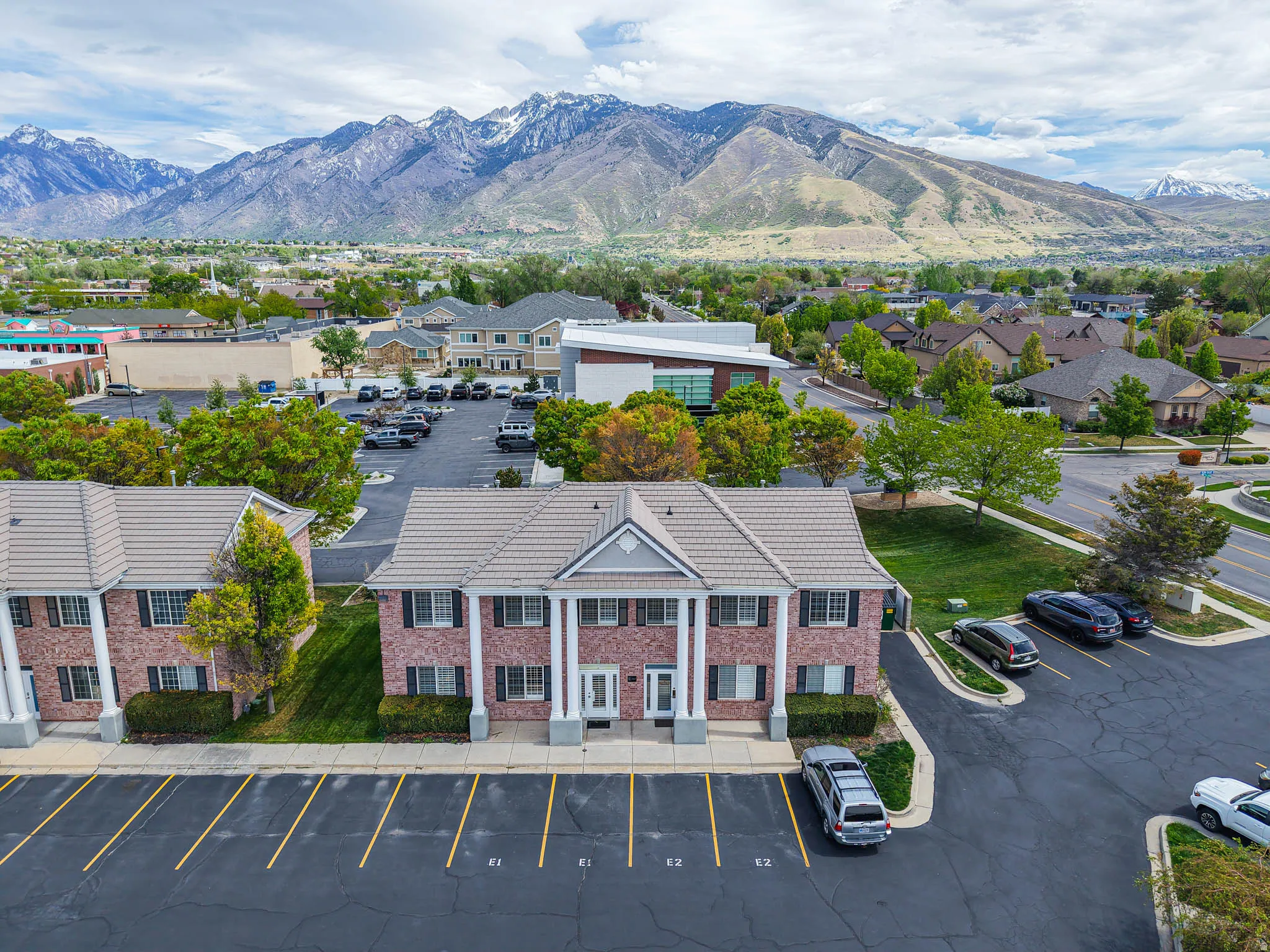 Aerial perspective of suburban area featuring a mountainous background