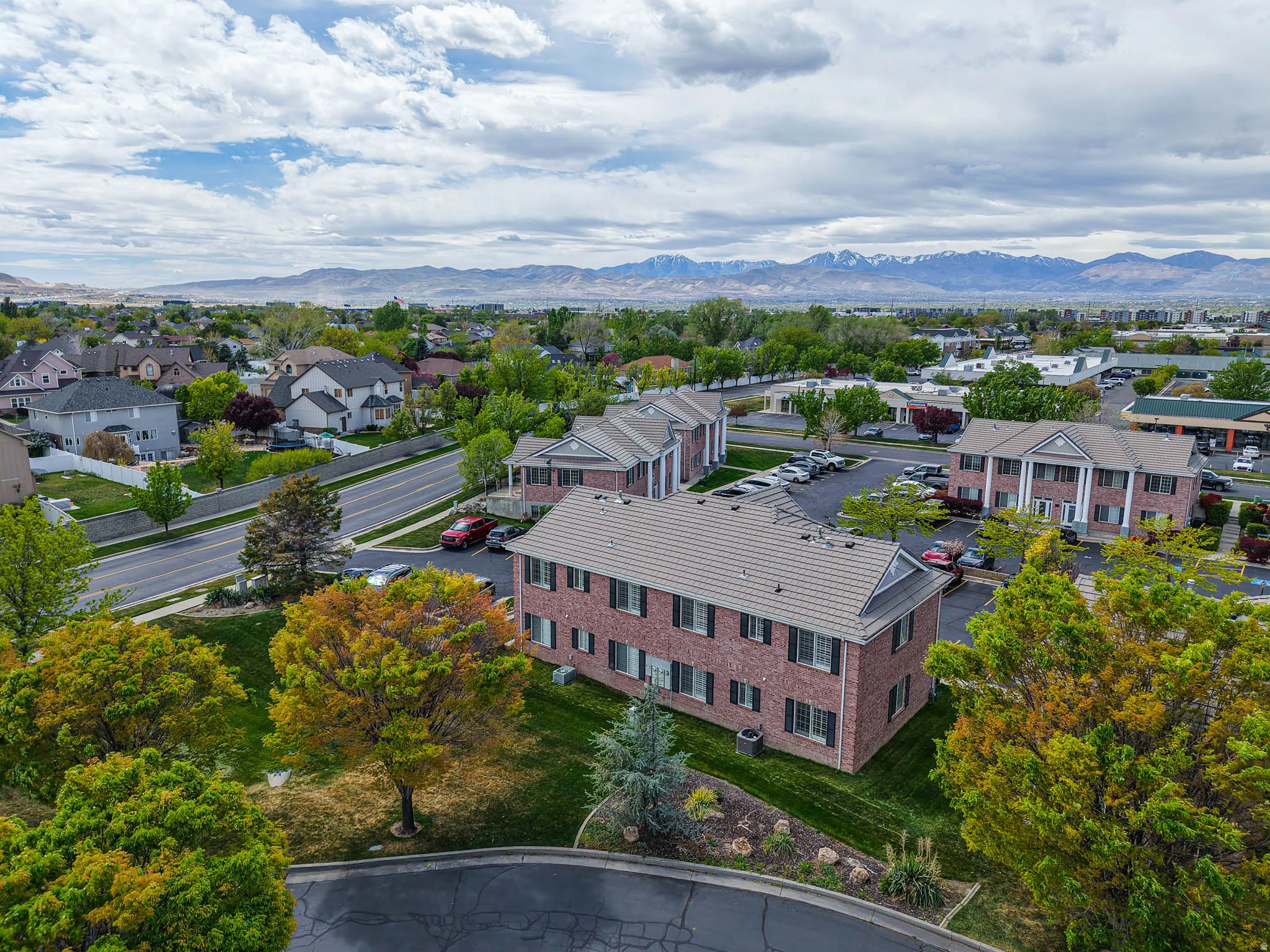 Aerial view of residential area featuring a mountain backdrop
