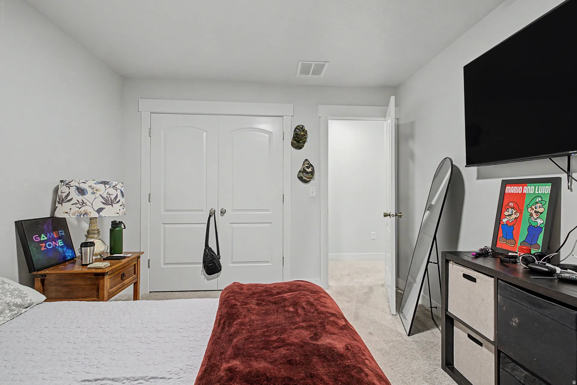 Interior room featuring light gray walls and plush carpeting