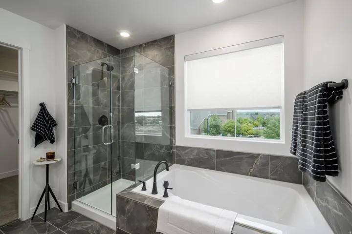 Spa-inspired primary bathroom designed for relaxation. * model home photo