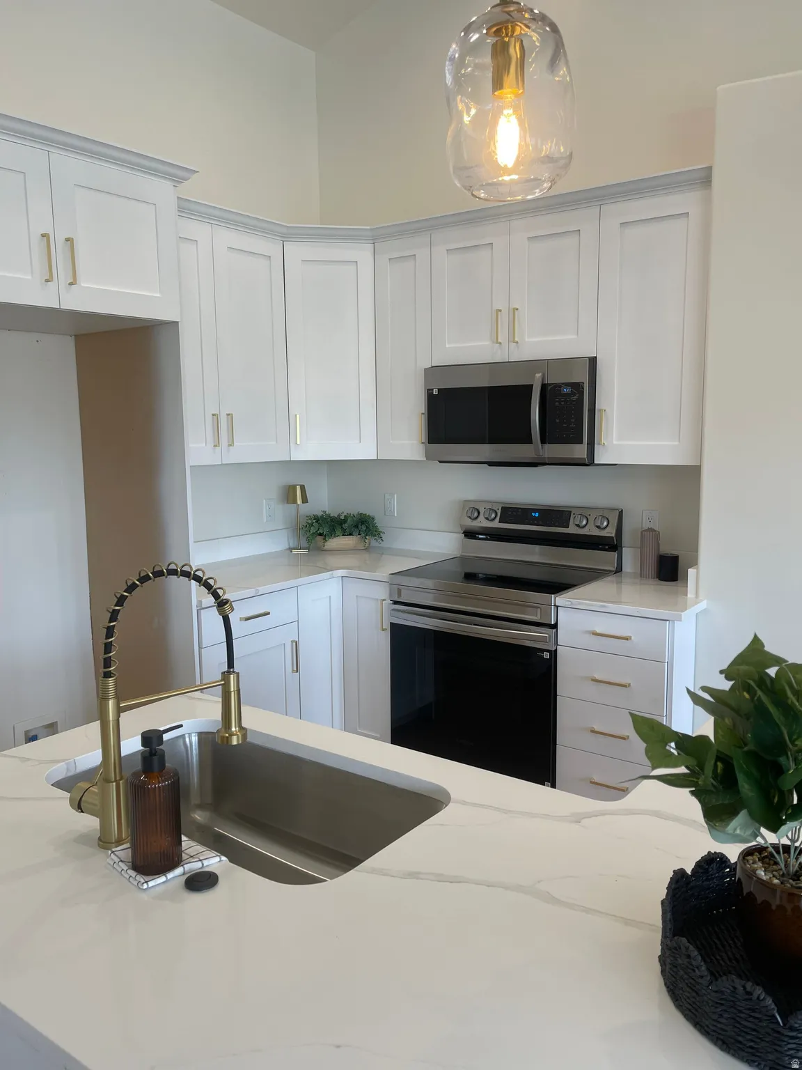 Newly installed cabinets with beautiful quartz countertops.