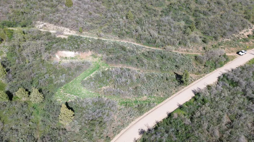 Expansive undeveloped land featuring varied terrain and natural vegetation