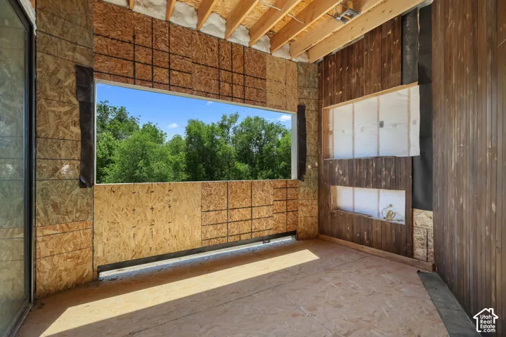 1 OF 2 OPEN PATIOS!  FIREPLACE TO BE INSTALLED!  SITS OF PRIMARY SUITE!  Framed opening providing an expansive outdoor panorama