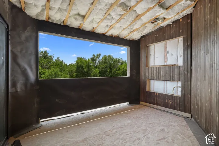 1 OF 2 OPEN PATIOS!  FIREPLACE TO BE INSTALLED! Expansive window opening framing mature trees and blue sky