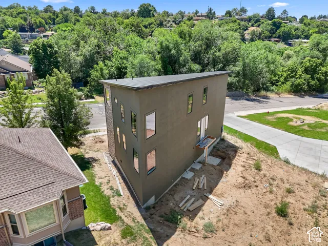 Contemporary multi-story exterior with stucco finish and a flat roofline