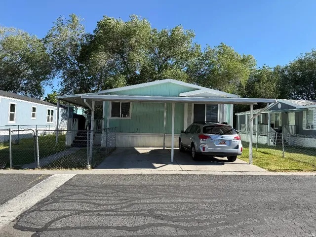 Mint green siding exterior with white trim
