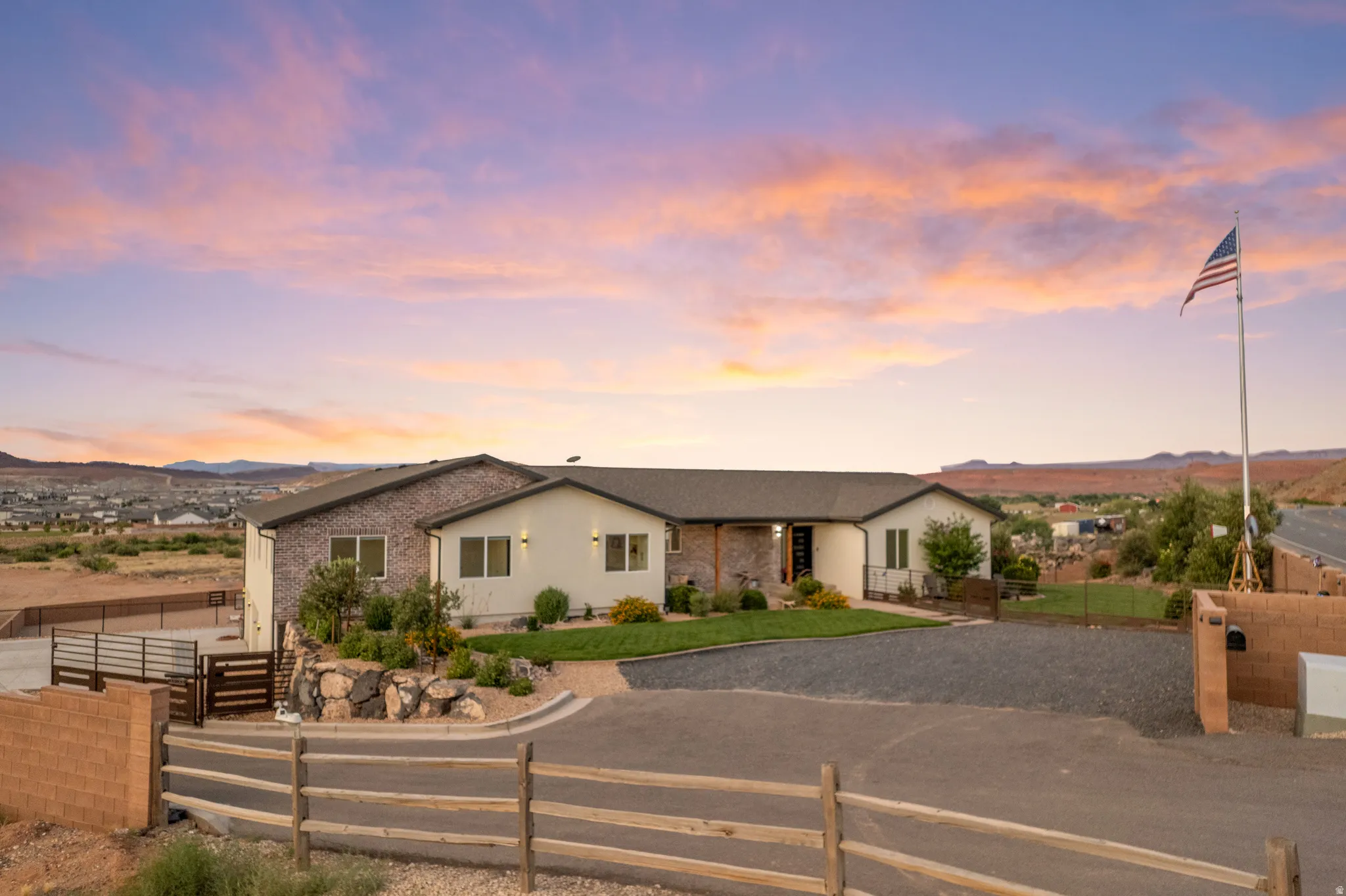 Contemporary residence featuring a stone and stucco exterior