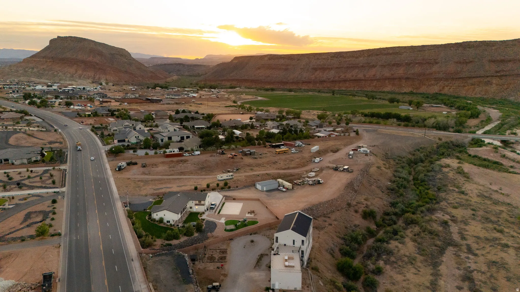 Aerial perspective showcasing an expansive desert landscape with distant mesas