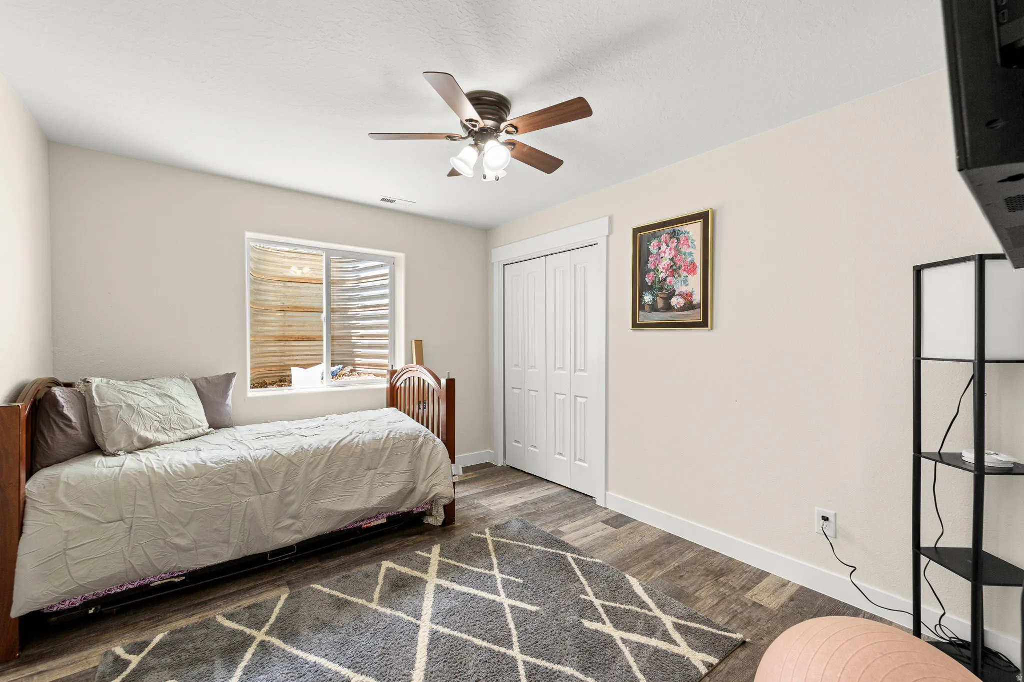 Neutral wall tones complemented by wood-finish flooring