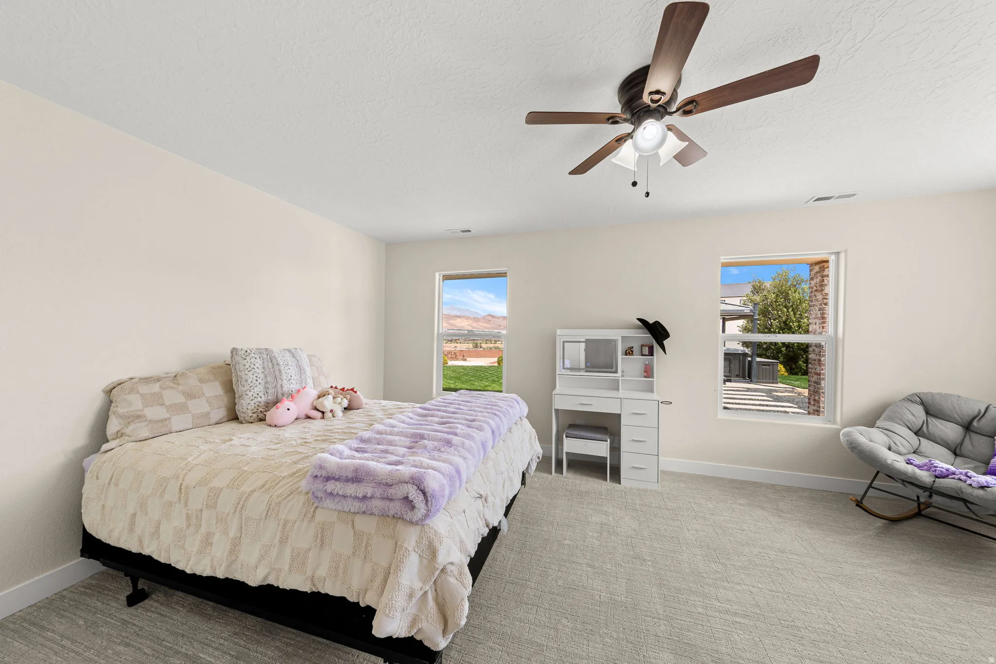 Neutral-toned walls complement plush carpeting