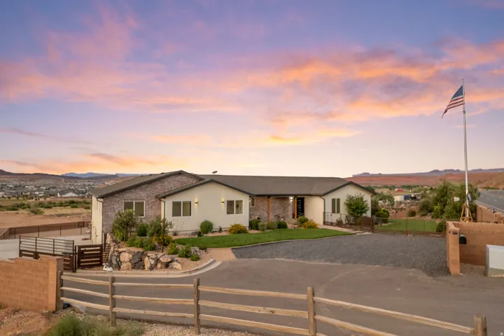 Contemporary residence featuring a stone and stucco exterior
