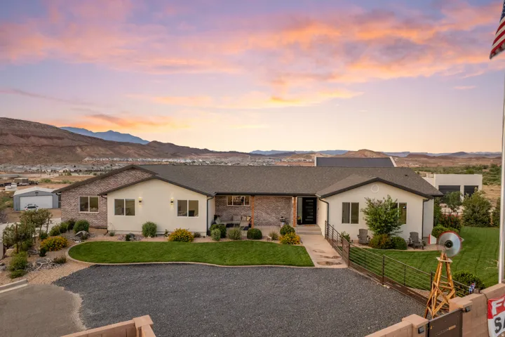 Expansive single-story residence featuring a combination of stucco and brick-veneer siding