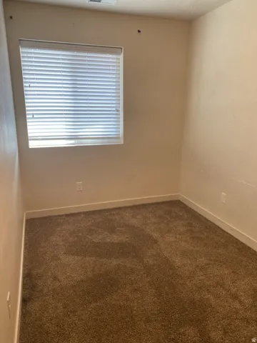 750-Neutral-toned walls complement plush brown carpeting