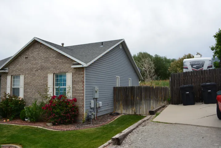 Exterior brick and siding combination with a pitched roof