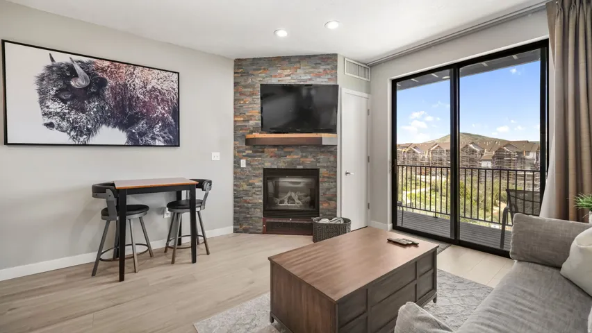 Living area featuring wood-finish flooring and light gray wall paint
