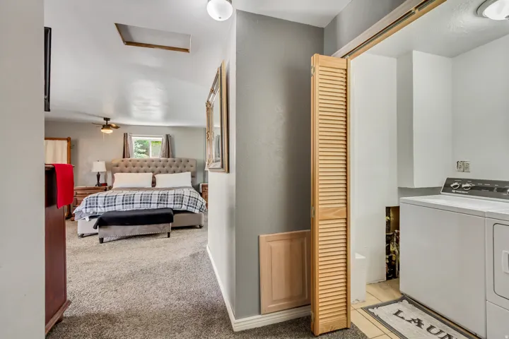 Carpeted bedroom with a ceiling fan, recessed lighting, and a skylight