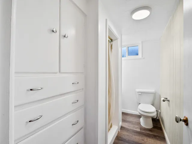 White built-in cabinetry and drawers provide storage