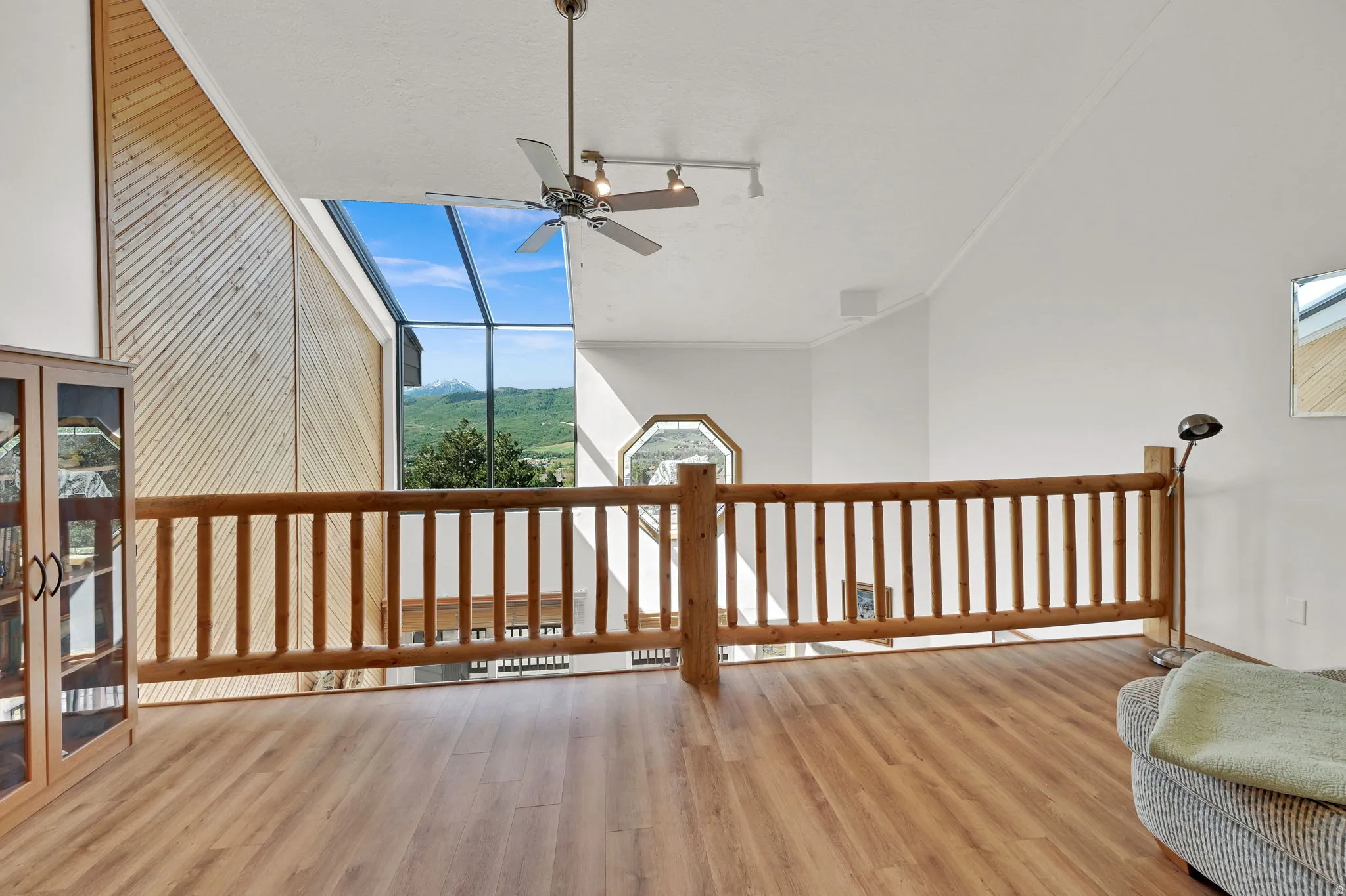 Vaulted ceilings with slatted wood-paneled accents