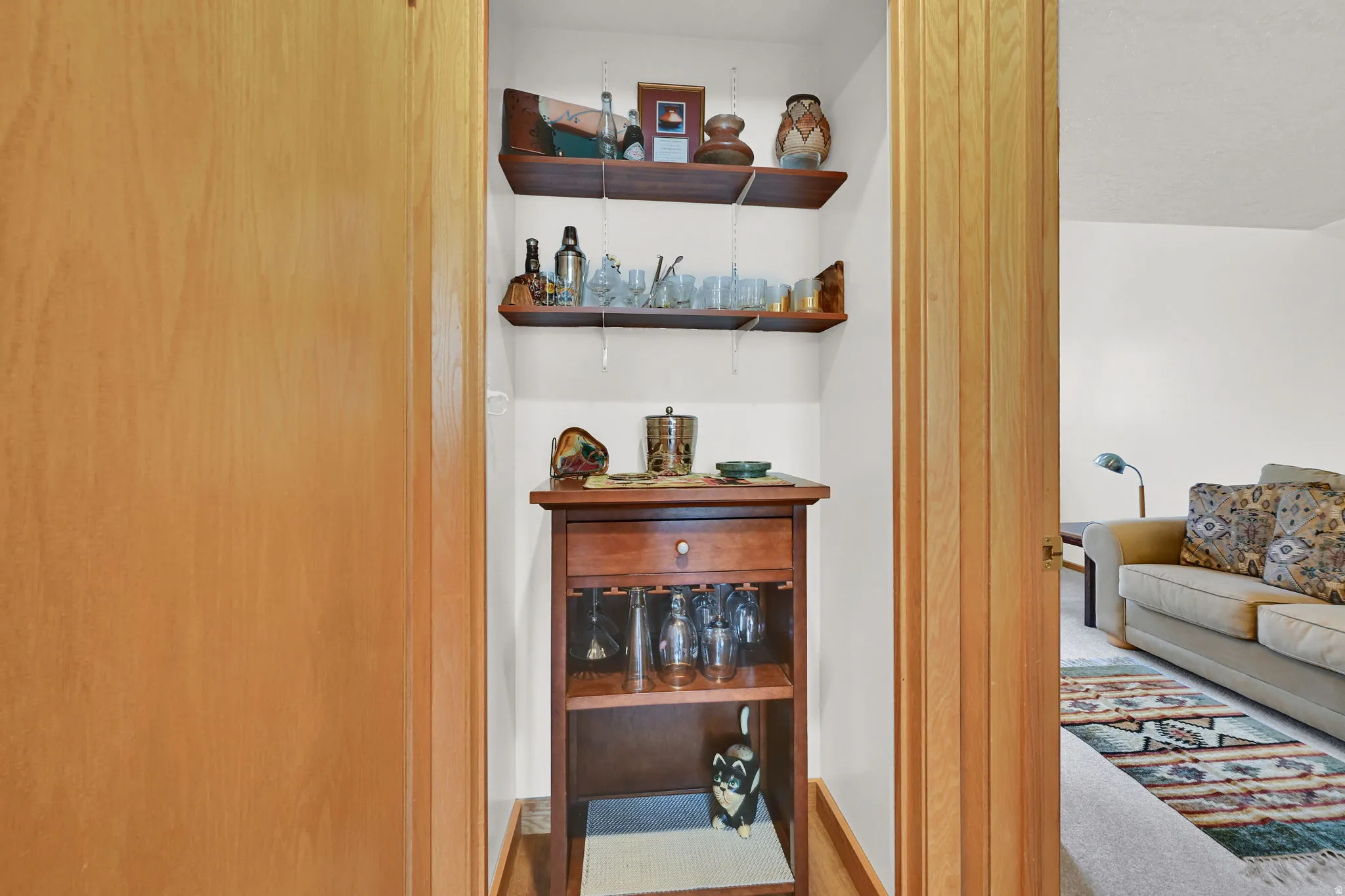 Recessed nook featuring built-in shelving and a dedicated space for a console table
