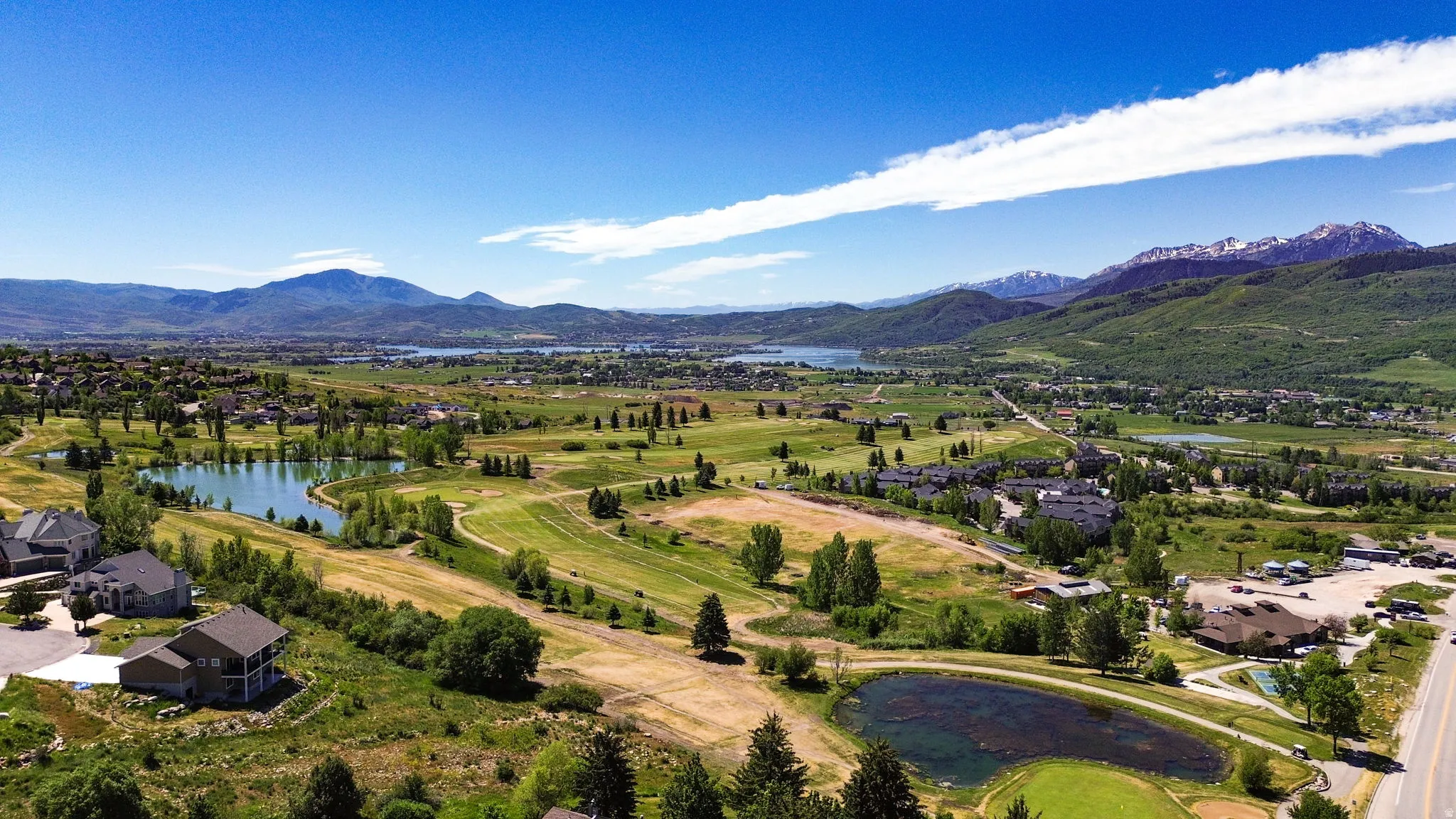 Wolf Creek Golf Course View.  Expansive aerial panorama showcasing a golf course landscape with multiple water features