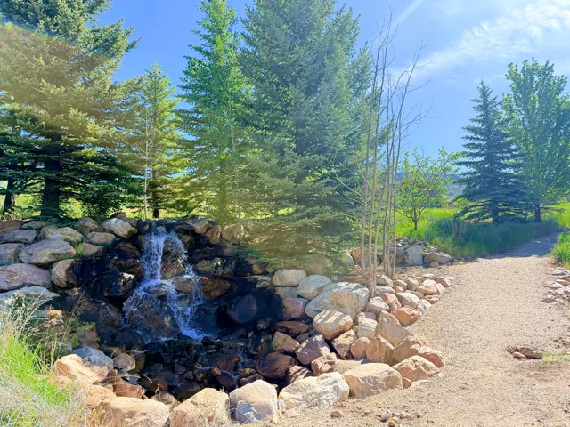 Community water feature at entrance with walking path