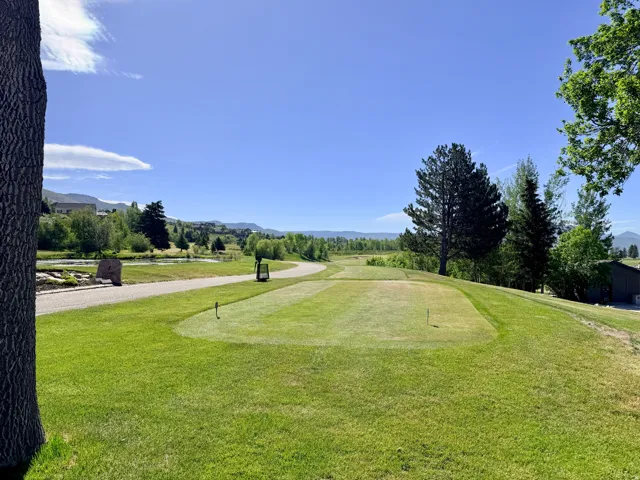 Wolf Creek golf course, winding cart path, water feature, and distant mountain ranges.  Walking distance.