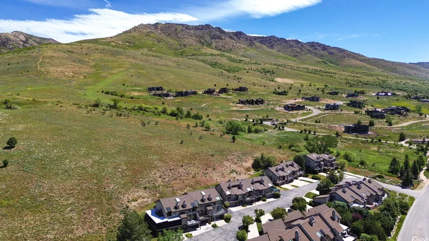 Townhome community set against a backdrop of rolling, green hills