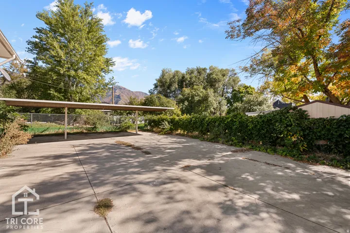 Paved driveway with an extended carport structure