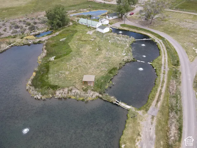 Multiple ponds with integrated aerators, a small dock, and a waterside gazebo structure