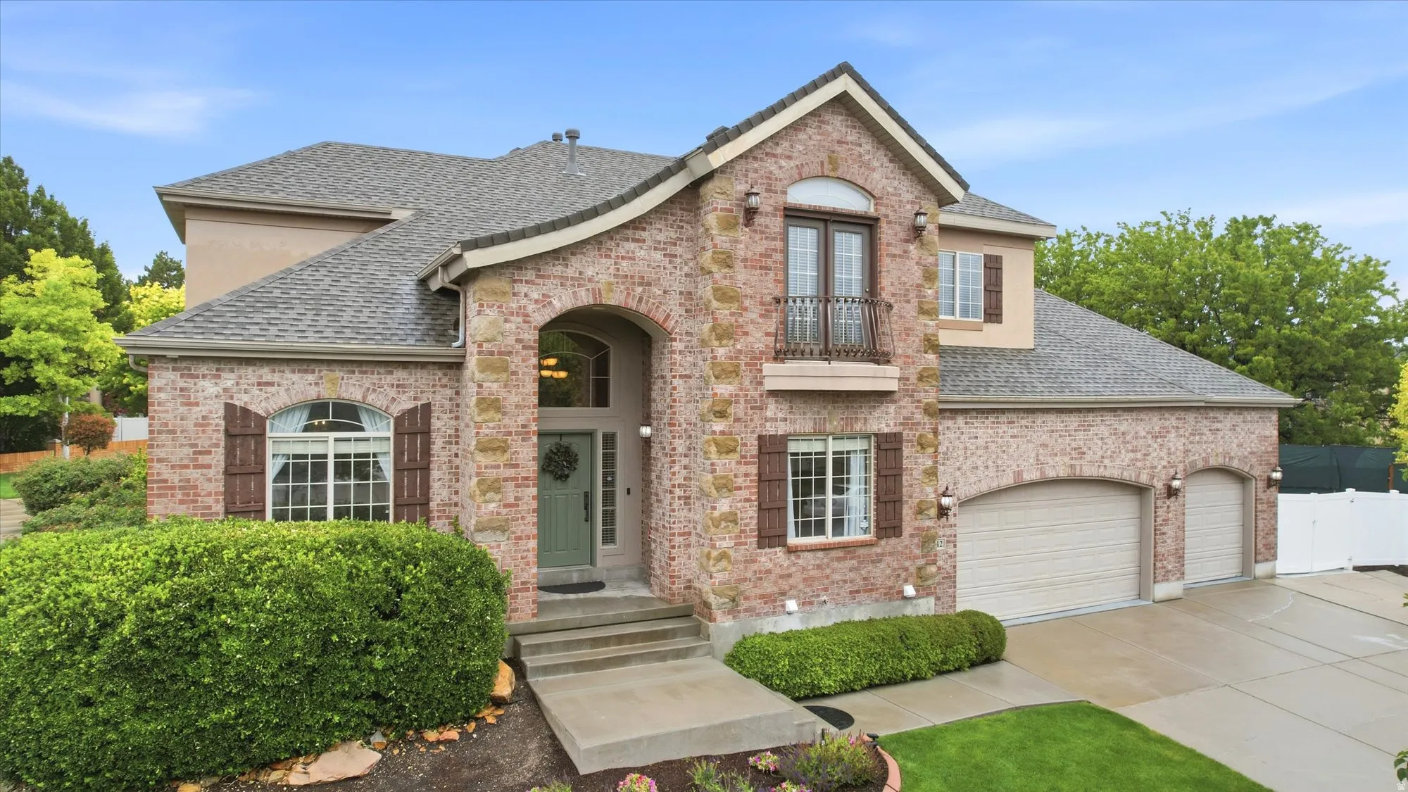 Brick and stucco exterior featuring a curved facade