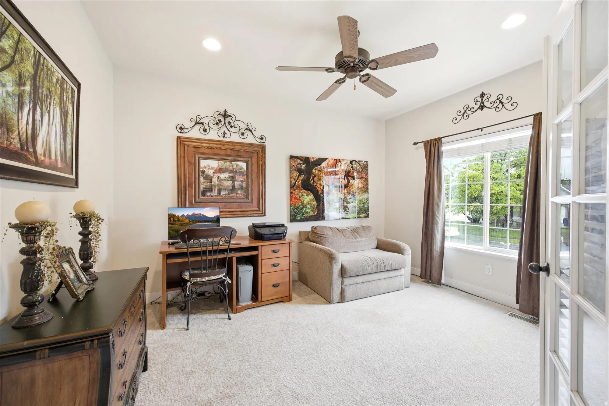 Carpeted room featuring a ceiling fan, recessed lighting, and a large window with white trim
