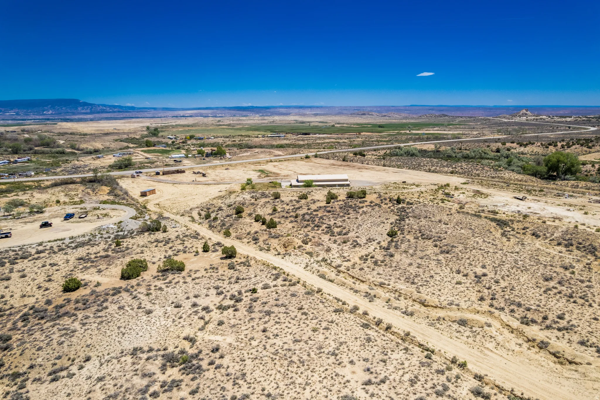 Expansive desert landscape with natural terrain and distant mountains
