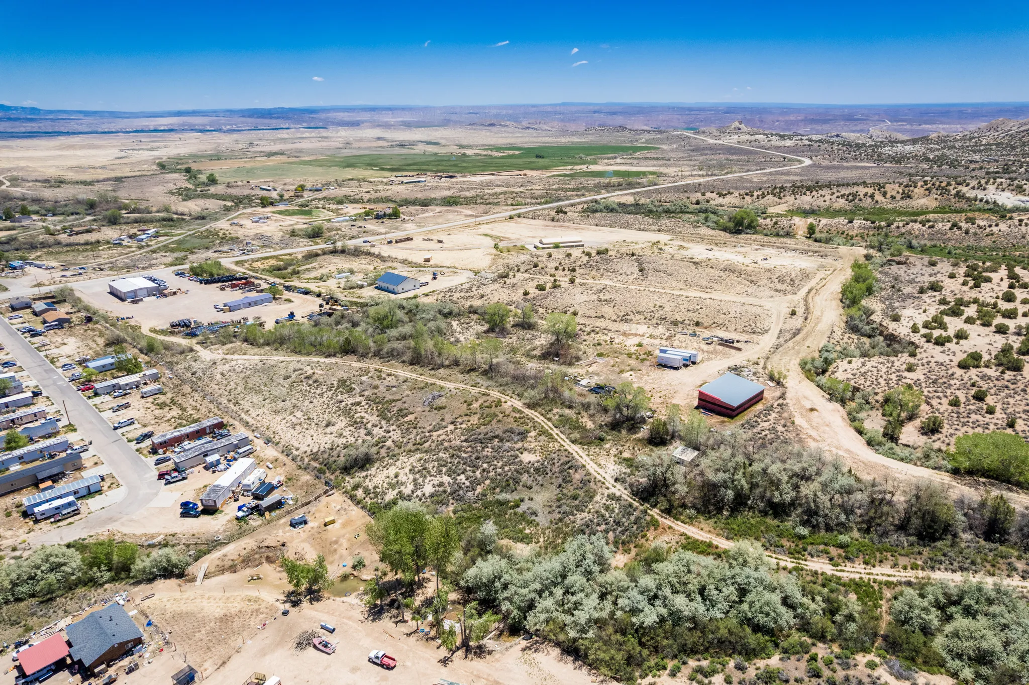 Expansive desert landscape with scattered green vegetation