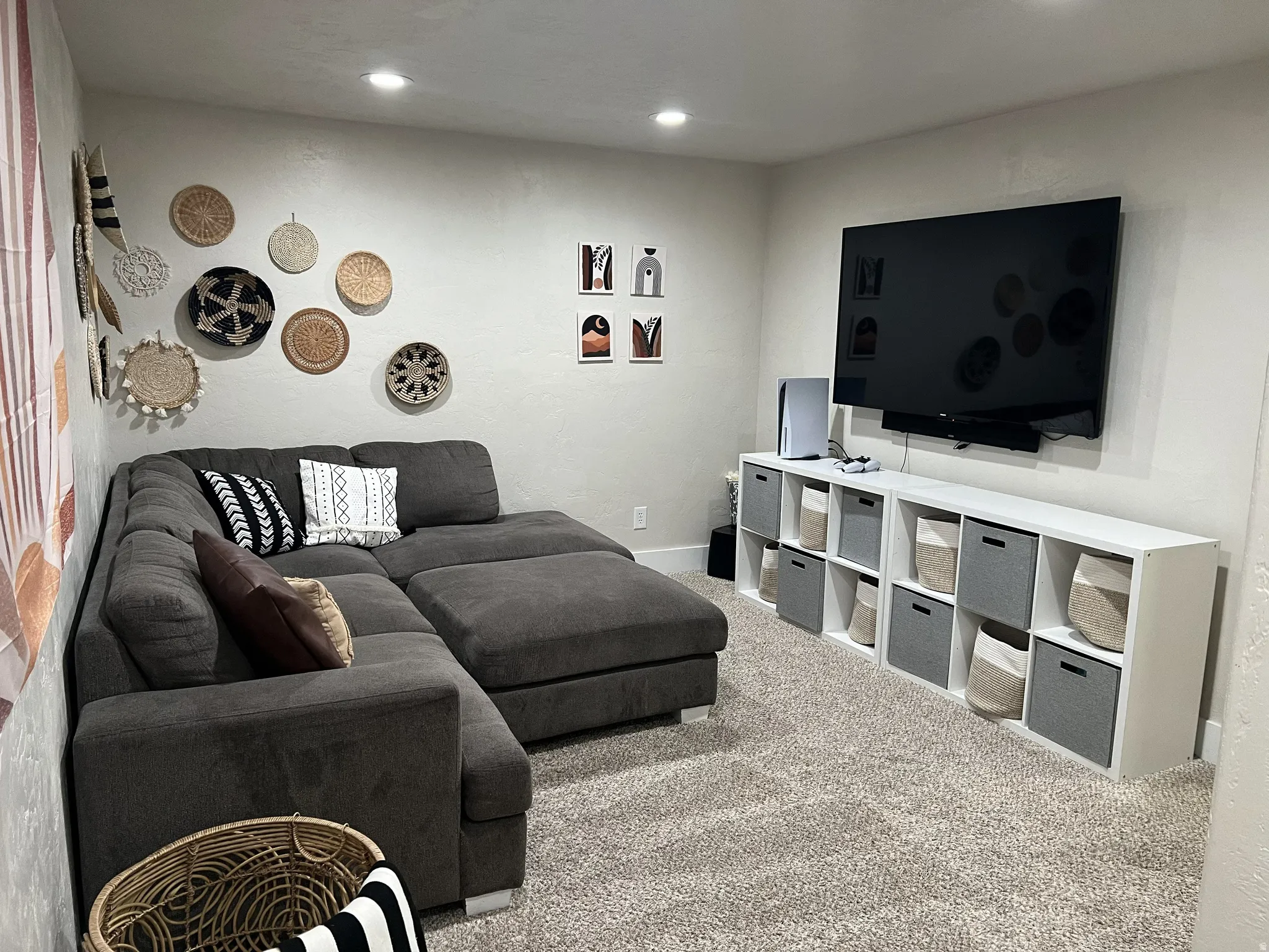 Carpeted room featuring recessed lighting, a built-in media console, and neutral wall tones