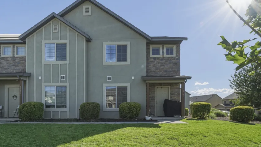 Contemporary exterior featuring stucco and stone accents