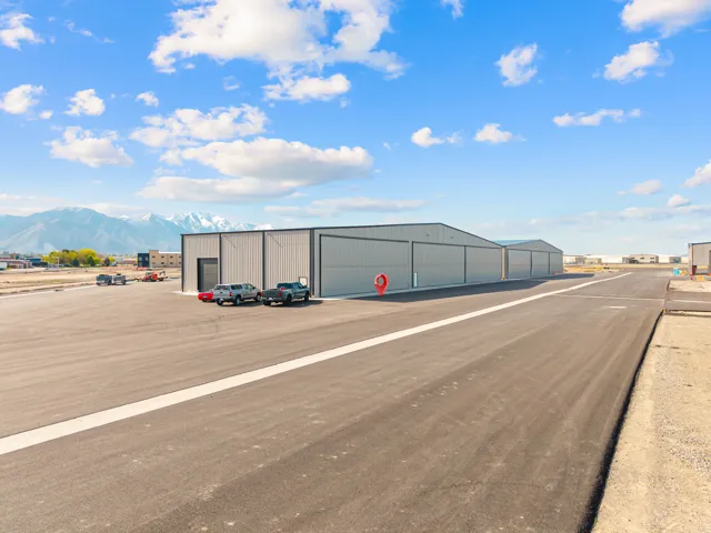 Multiple metal-clad hangars featuring large sliding doors