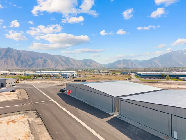 Industrial facility featuring modern metal siding and a flat roofline