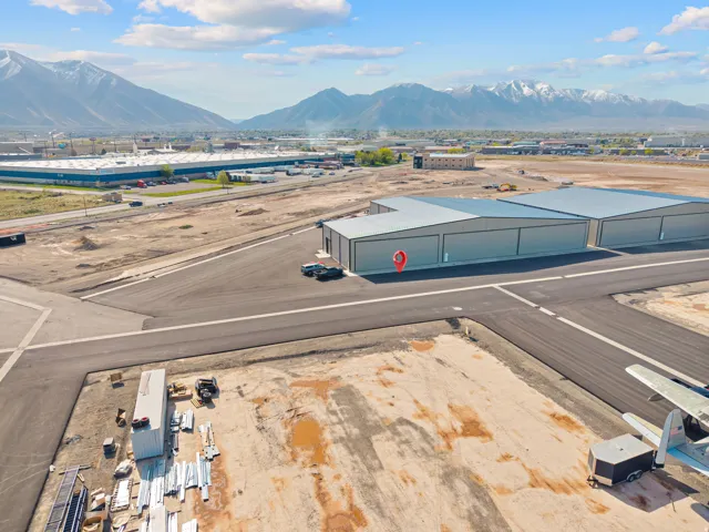 Modern aviation hangar featuring multiple bays and direct tarmac access