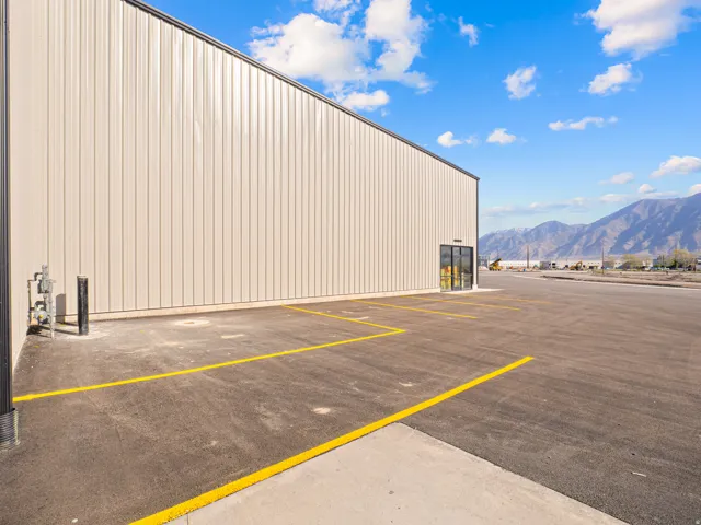 Expansive paved parking area with visible yellow demarcation lines
