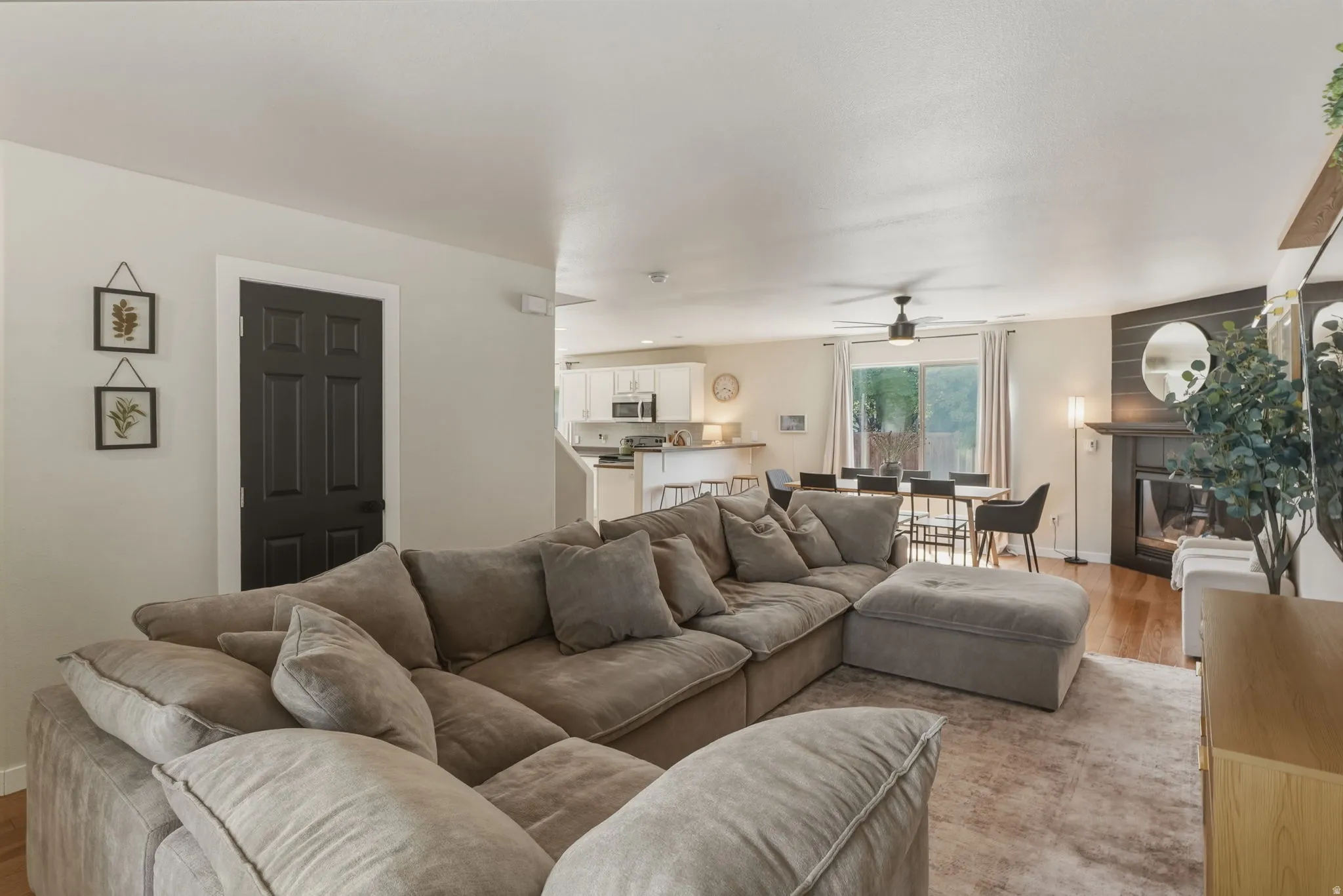 Open-concept living area with wood-finish flooring